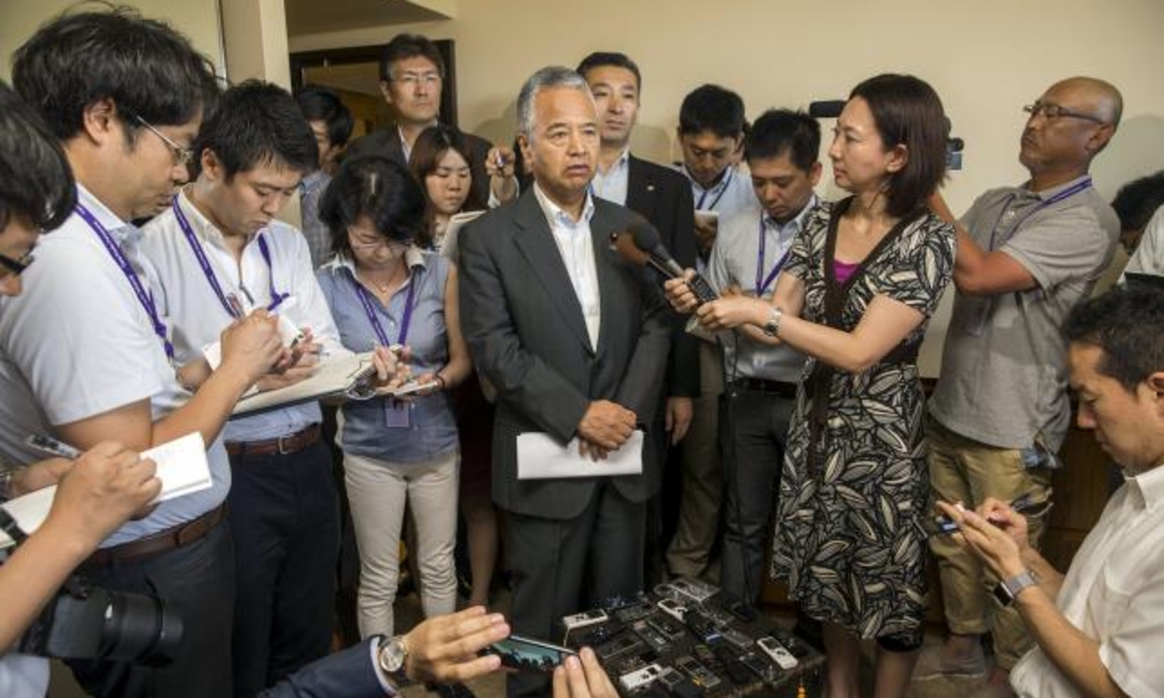 Bộ trưởng Tài chính Nhật Bản Akira Amari tại một cuộc họp báo bên lề đàm phán Hiệp định Đối tác xuyên Thái Bình Dương (TPP) tại Hawaii, hôm 30/7. Trong khuôn khổ đàm phán, Nhật Bản đã bác bỏ đề nghị thiết lập một điễn đàn nhằm ngăn các quốc gia thao túng tỷ giá - Ảnh: Reuters.<br>