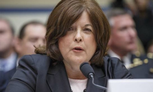 Obama đi chung thang máy với người lạ mang vũ khí