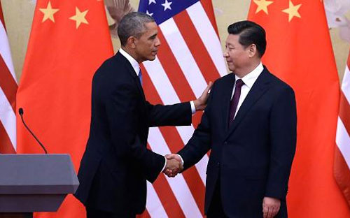 Tổng thống Mỹ Barack Obama (trái) và Chủ tịch Trung Quốc Tập Cận Bình tại hội nghị thượng đỉnh Diễn đàn Hợp tác kinh tế châu Á-Thái Bình Dương (APEC) lần thứ 22 - Ảnh: Getty.<br>