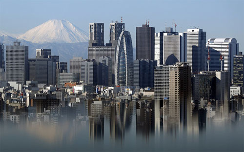 Trong số các nền kinh tế phát triển, kinh tế Nhật có mức tăng trưởng đuối nhất trong quý 4 - Ảnh: Bloomberg.<br>