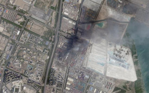 Ảnh chụp từ vệ tinh sau vụ nổ ở Thiên Tân, Trung Quốc ngày 12/8 - Ảnh: Reuters.<br>