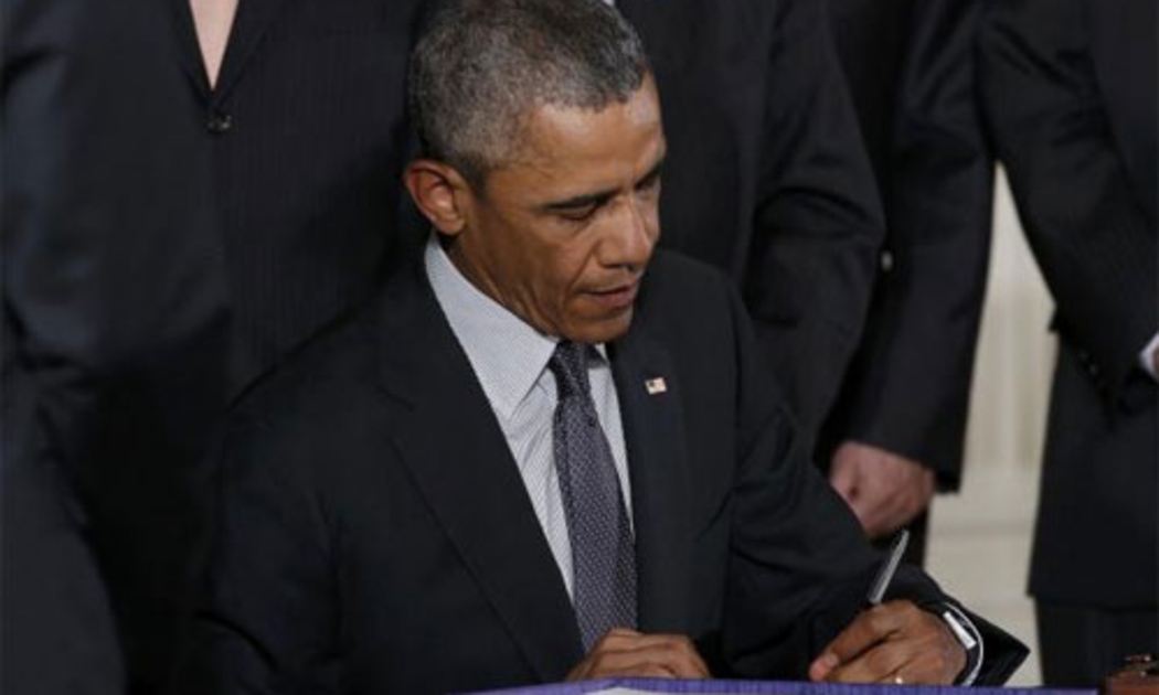 Tổng thống Mỹ Barack Obama trong lễ ký luật ngày 29/6 - Ảnh: Reuters.<br>