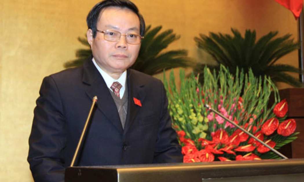Chủ nhiệm Ủy ban Tài chinh - Ngân sách trình bày báo cáo thẩm tra quyết toán ngân sách nhà nước năm 2013.