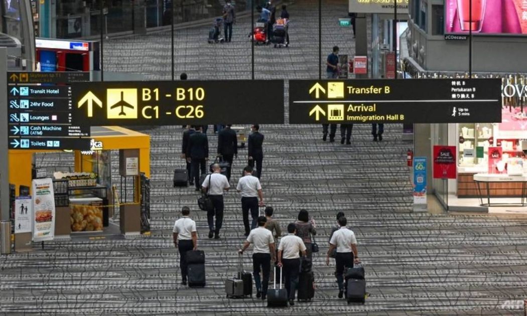 Hành khách tại sân bay Changi, Singapore ngày 14/1 - Ảnh: AFP/Getty Images.