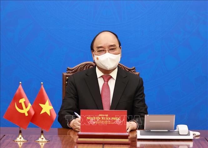 Chủ tịch nước Nguyễn Xuân Phúc tại cuộc điện đàm với Tổng Bí thư, Chủ tịch Trung Quốc Tập Cận Bình chiều 24/5 - Ảnh: TTXVN.