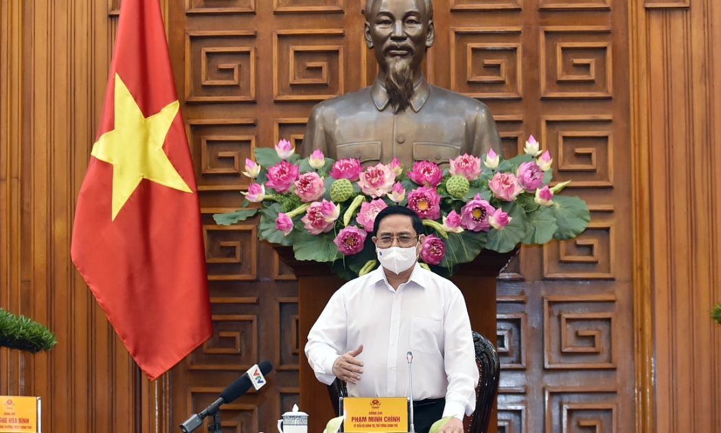 Thủ tướng Chính phủ Phạm Minh Chính tại cuộc họp của Thường trực Chính phủ về phòng chống Covid-19 chiều 24/5 - Ảnh: VGP