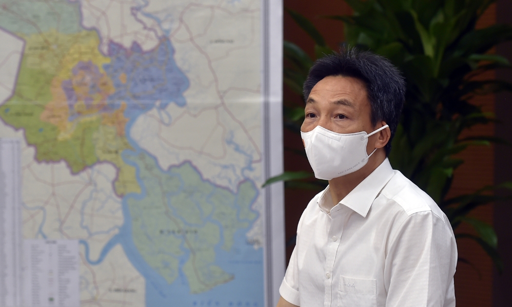Phó Thủ tướng Vũ Đức Đam chủ trì cuộc họp với các địa phương lân cận TP.HCM chiều 9/7. Ảnh - VGP. 