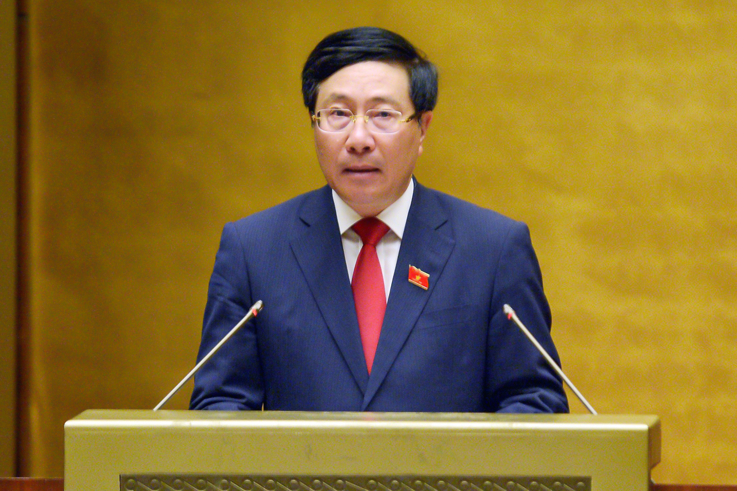 Ủy viên Bộ Chính trị, Phó Thủ tướng Chính phủ Phạm Bình Minh báo cáo tại kỳ họp thứ nhất Quốc hội khóa XV sáng 22/7 - Ảnh: Quochoi.vn