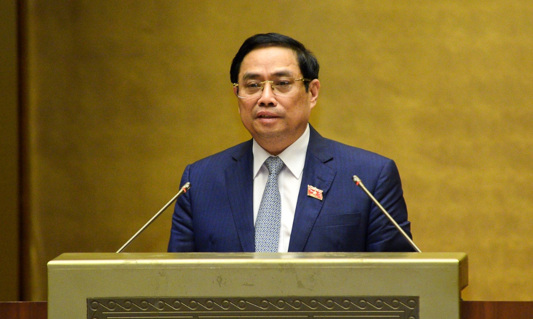 Thủ tướng Chính phủ nhiệm kỳ 2016-2021 Phạm Minh Chính trình bày Tờ trình về cơ cấu tổ chức của Chính phủ nhiệm kỳ Quốc hội khóa XV - Ảnh: Quochoi.vn
