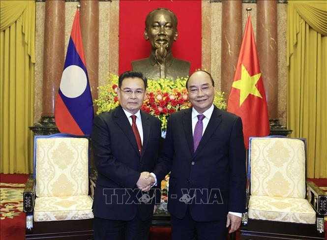 Chủ tịch nước Nguyễn Xuân Phúc tiếp Chủ tịch Quốc hội Lào Xaysomphone Phomvihane - Ảnh: TTXVN