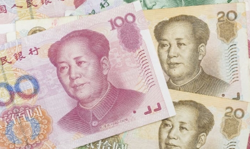 Đồng Nhân dân tệ chịu áp lực giảm giá sau khi Trung Quốc hạ lãi suất