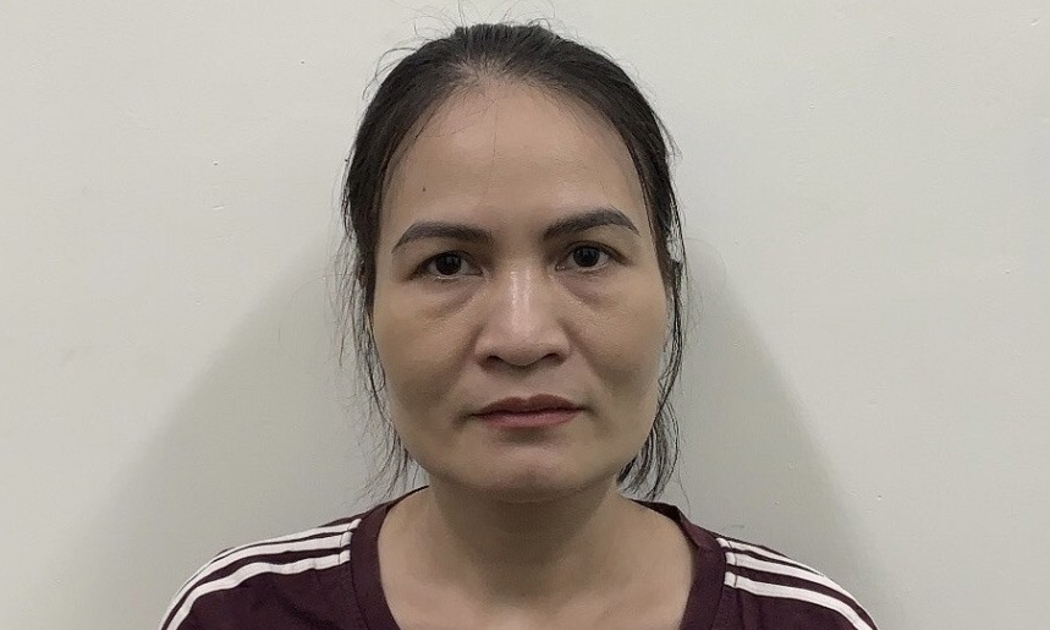 Bà Nga khi bị bắt. Ảnh Công an TP Hà Nội.