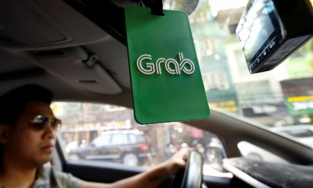 Giá cổ phiếu Grab đã giảm hơn 70% kể từ khi niêm yết - Ảnh: Reuters
