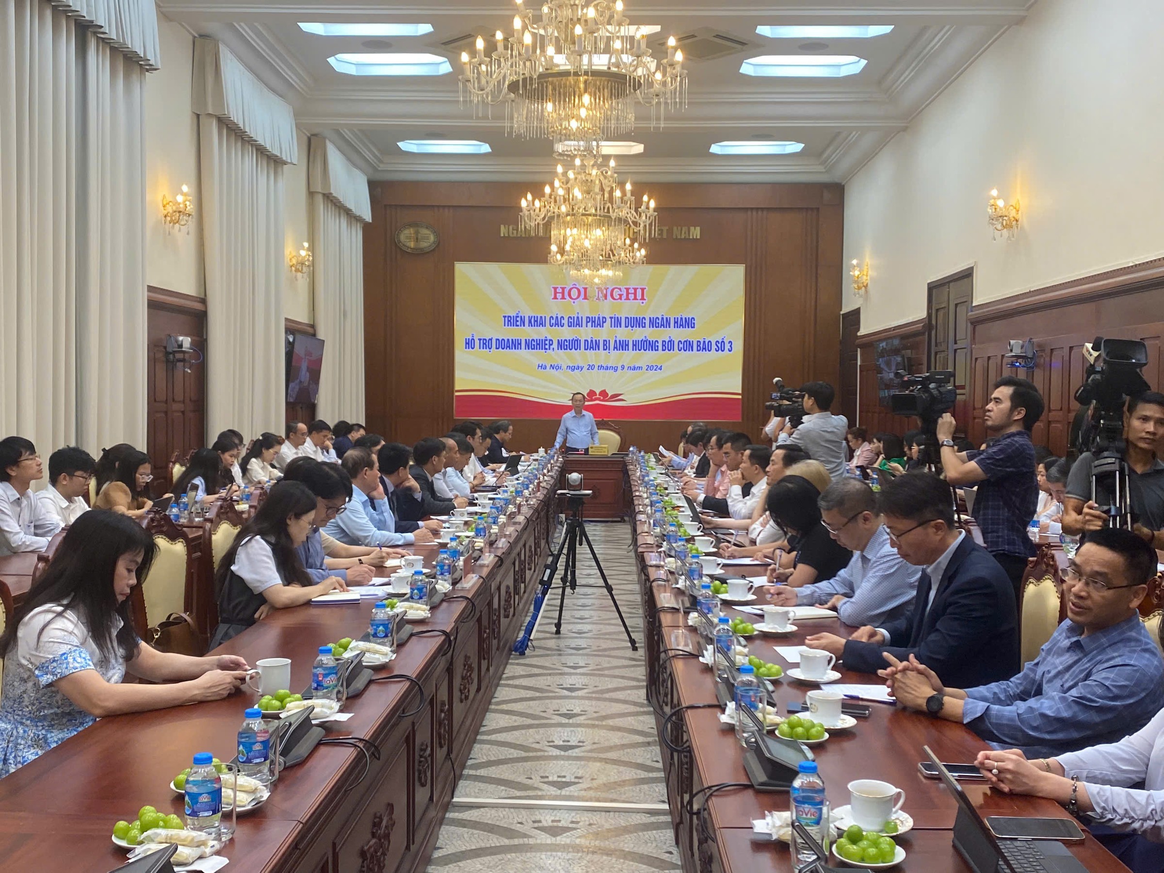 Hội nghị Triển khai các giải pháp tín dụng ngân hàng hỗ trợ doanh nghiệp, người dân bị ảnh hưởng bởi cơn bão số 3 .