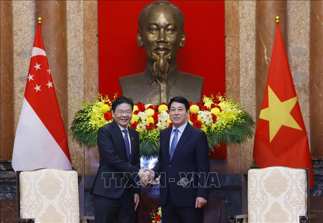 Chủ tịch nước Lương Cường và Thủ tướng Singapore Lawrence Wong - Ảnh: TTXVN