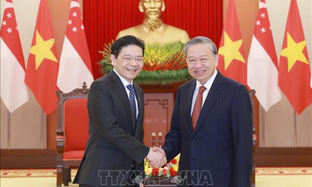 Tổng Bí thư Tô Lâm và Thủ tướng Cộng hòa Singapore Lawrence Wong - Ảnh: TTXVN