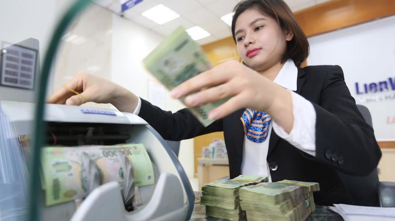 Tín dụng được giao chỉ tiêu tăng trưởng thấp là trở ngại chính trong bức tranh lợi nhuận ngân hàng Việt Nam năm 2018 - Ảnh: Quang Phúc.