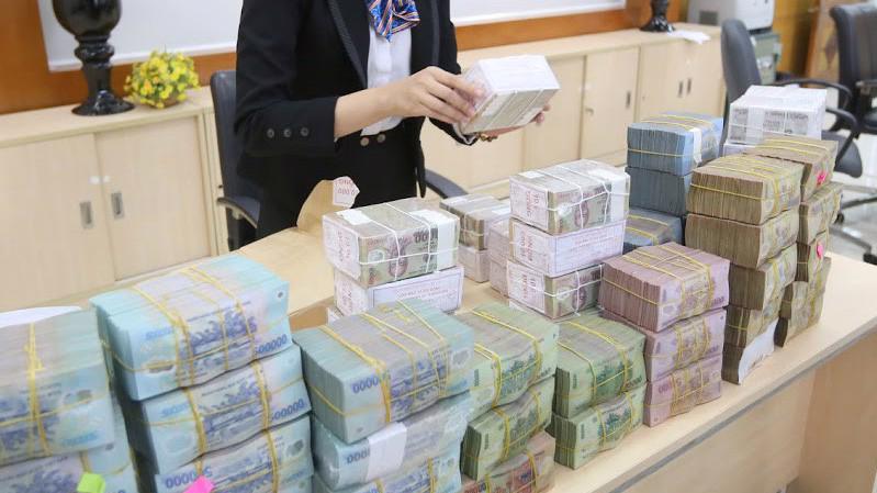 Theo con số tuyệt đối, quy mô lợi nhuận hệ thống các ngân hàng thương mại Việt Nam năm qua đã có xáo trộn lớn, với sự lấn át chính thức của khối ngân hàng thương mại cổ phần tư nhân - Ảnh: Quang Phúc.