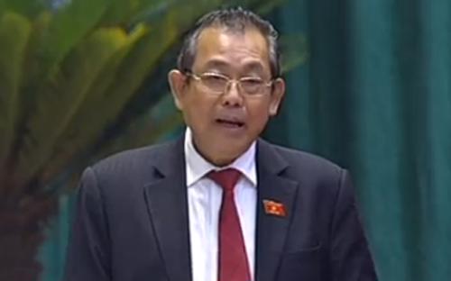Chánh án Trương Hòa Bình trả lời chất vấn trước Quốc hội, sáng 21/11.<br>