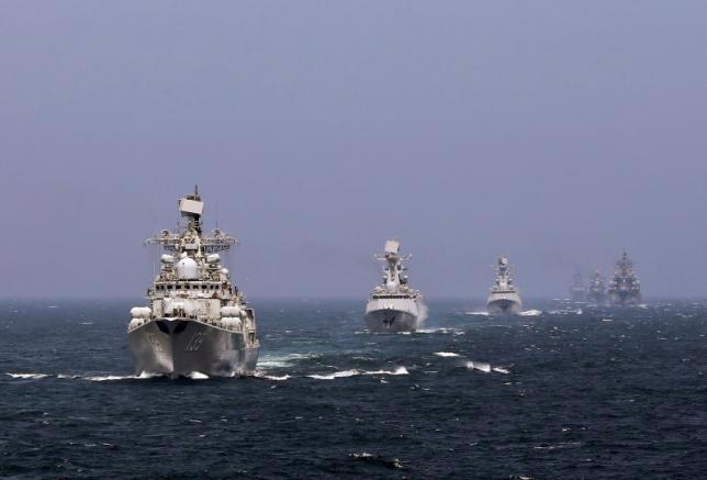 Tàu hải quân Nga và Trung Quốc trong cuộc tập trận chung giữa hai nước ở biển Hoa Đông hồi tháng 5/2014 - Ảnh: Reuters/China Daily.<br>