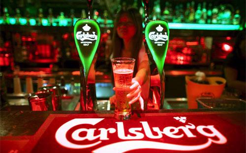 Carlsberg cũng tiếp tục cắt giảm dự báo lợi nhuận của hãng trong năm 2015 - Ảnh: Reuters/WSJ.<br>