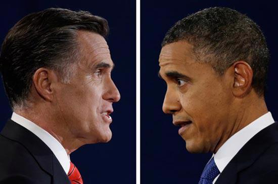 Thượng nghị sỹ Mitt Romney (trái) và Tổng thống Barack Obama trong cuộc tranh luận trực tiếp sáng nay - Ảnh: AP.