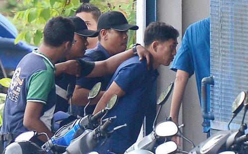 Nghi phạm Ri Jong Chon bị cảnh sát Malaysia bắt giữ hôm 17/2 - Ảnh: Reuters.
