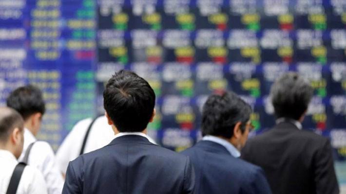 Nguy cơ chiến tranh thương mại đang phủ bóng đen lên thị trường chứng khoán châu Á - Ảnh: Reuters.