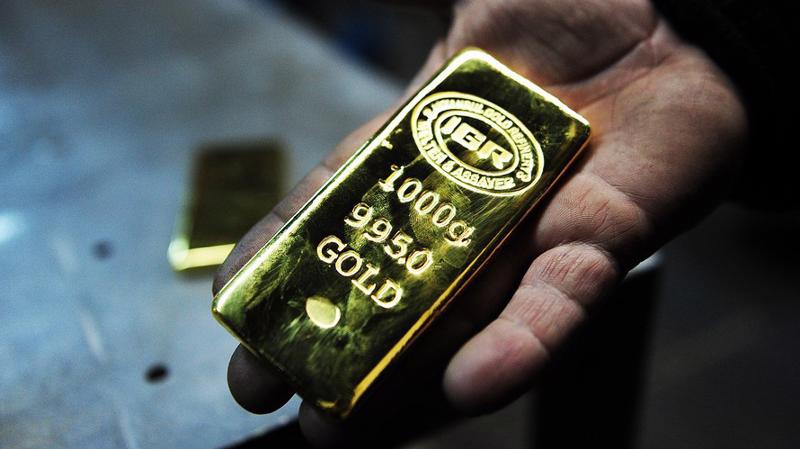 Đồng USD tăng giá tạo áp lực giảm lên giá vàng thế giới - Ảnh: Getty/Market Watch.