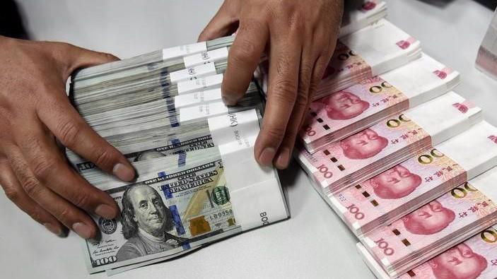 Trong vòng 6 tháng qua, đồng Nhân dân tệ đã giảm giá 9% so với đồng USD, trở thành một trong những đồng tiền rớt giá mạnh nhất ở khu vực châu Á - Ảnh: Reuters.