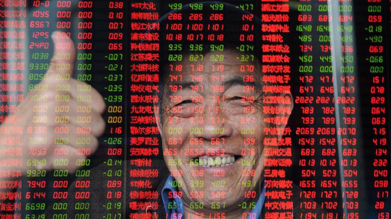 Tin "đình chiến" thương mại Mỹ-Trung giúp chứng khoán Trung Quốc tăng điểm sáng đầu tuần - Ảnh: Bloomberg.