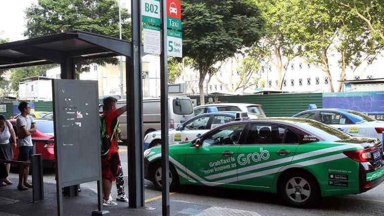 Dịch vụ taxi công nghệ đang rất phổ biến ở Singapore - Ảnh: Straits Times.