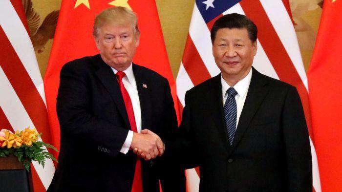 Tổng thống Mỹ Donald Trump (trái) và Chủ tịch Trung Quốc Tập Cận Bình trong cuộc gặp ở Bắc Kinh tháng 11/2017 - Ảnh: Reuters.