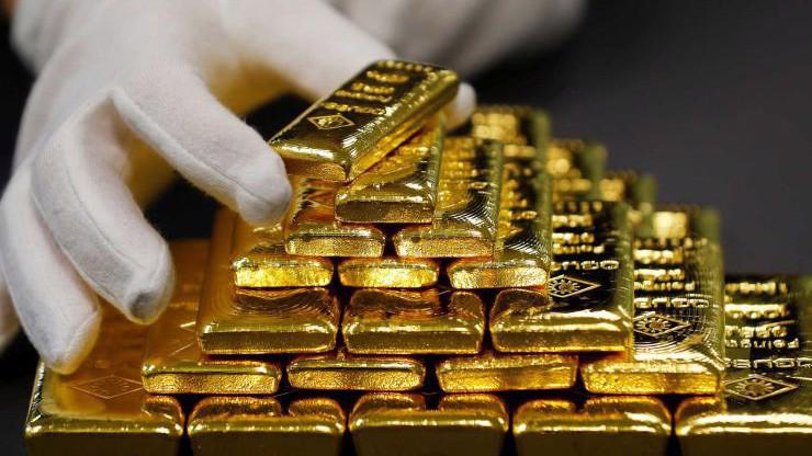 Mức giá hiện tại của vàng thế giới là thấp nhất trong 4 tháng trở lại đây - Ảnh: Reuters.
