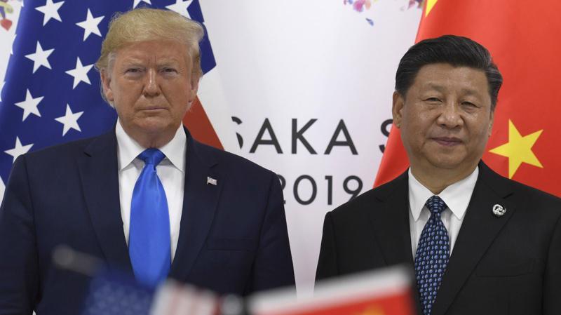 Tổng thống Mỹ Donald Trump (trái) và Chủ tịch Trung Quốc Tập Cận Bình - Ảnh: Reuters.
