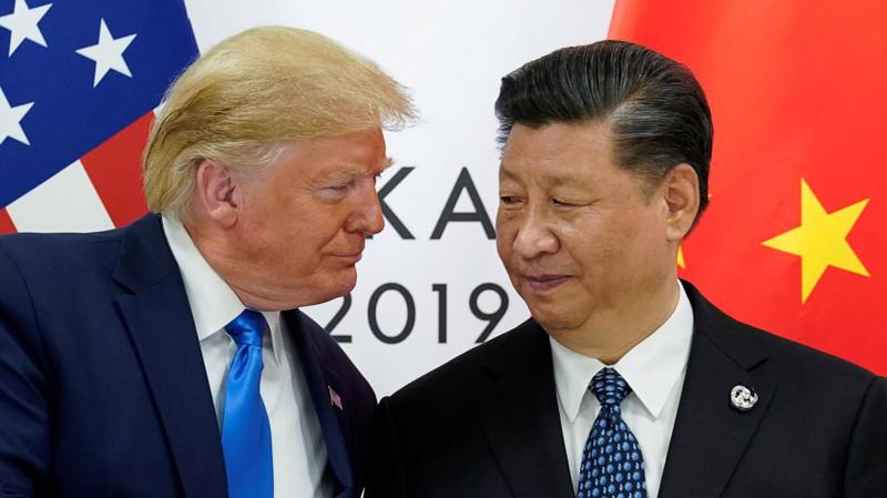 Tổng thống Mỹ Donald Trump (trái) và Chủ tịch Trung Quốc Tập Cận Bình trong cuộc gặp ở Nhật Bản, tháng 6/2019 - Ảnh: Reuters.