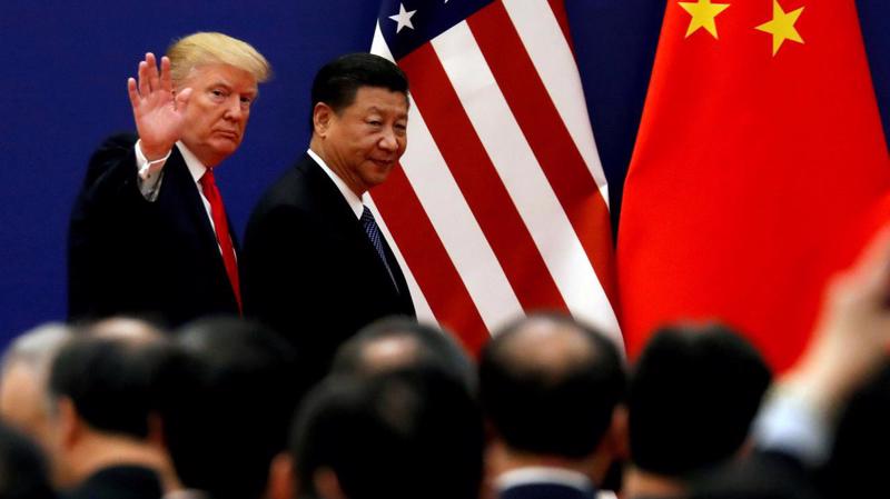 Tổng thống Mỹ Donald Trump (trái) và Chủ tịch Trung Quốc Tập Cận Bình trong một lần gặp - Ảnh: Reuters.