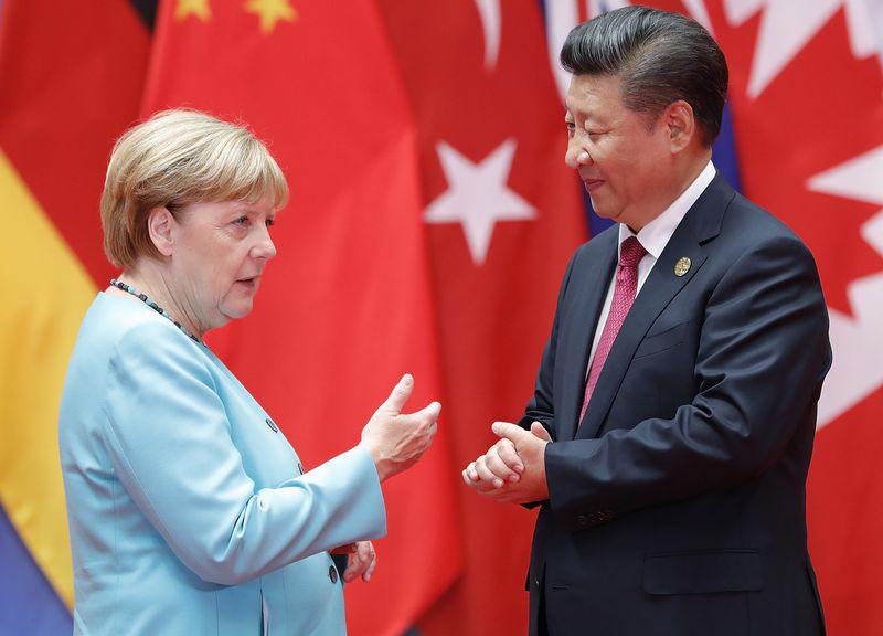 Thủ tướng Đức Angela Merkel (trái) và Chủ tịch Trung Quốc Tập Cận Bình - Ảnh: Getty/Bloomberg.<br>