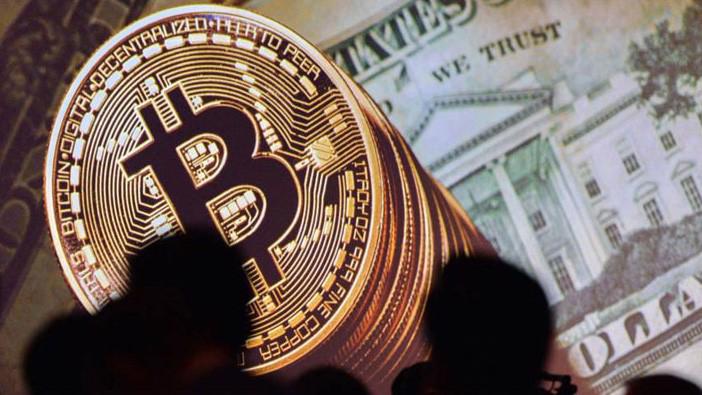 Giá tiền ảo Bitcoin đang hướng đến mốc 10.000 USD - Ảnh: JIJI/Japan Times.