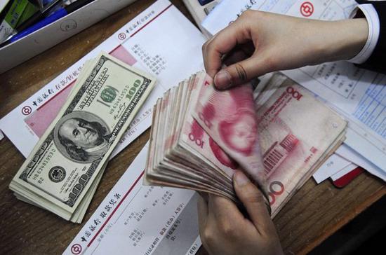 Trung Quốc mới đây tuyên bố tăng tính linh hoạt cho tỷ giá Nhân dân tệ - Ảnh: Reuters.