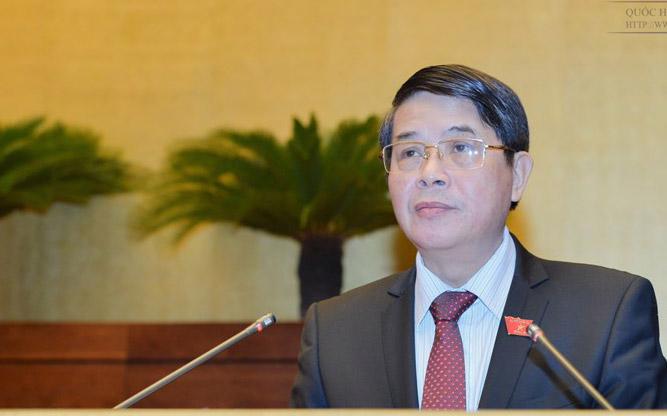 Chủ nhiệm Uỷ ban Tài chính - Ngân sách Nguyễn Đức Hải trình bày báo cáo thẩm tra dự án Luật Quản lý nợ công (sửa đổi).