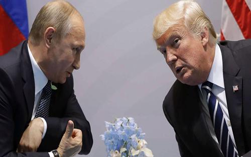 Nga phủ nhận cáo buộc can thiệp bầu cử Mỹ trong cuộc gặp đầu tiên của hai nhà lãnh đạo - Ảnh: AP.
