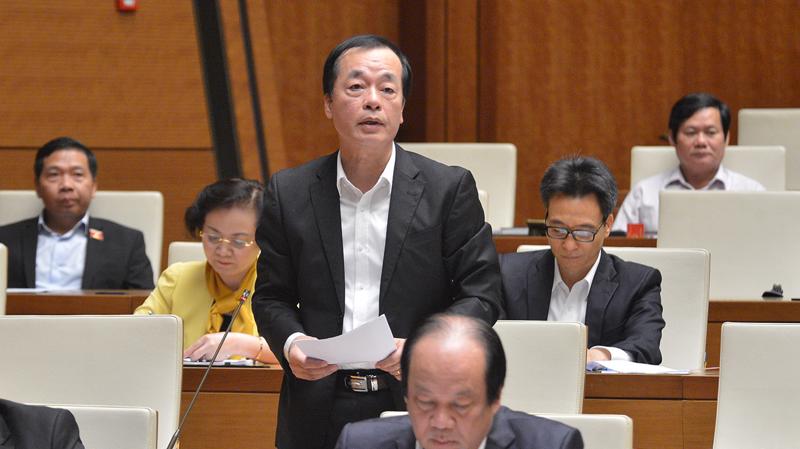 Bộ trưởng Bộ Xây dựng Phạm Hồng Hà trả lời chất vấn của các đại biểu Quốc hội - Ảnh: Quochoi.vn