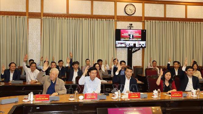 Tổng Bí thư, Chủ tịch nước Nguyễn Phú Trọng và các đại biểu biểu quyết tại hội nghị chiều 11/3 - Ảnh: TTXVN