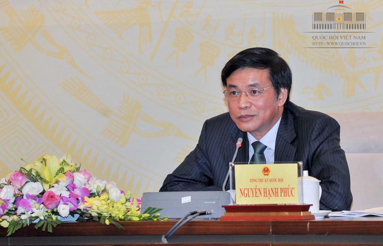 Ông Nguyễn Hạnh Phúc trả lời tại buổi họp báo.