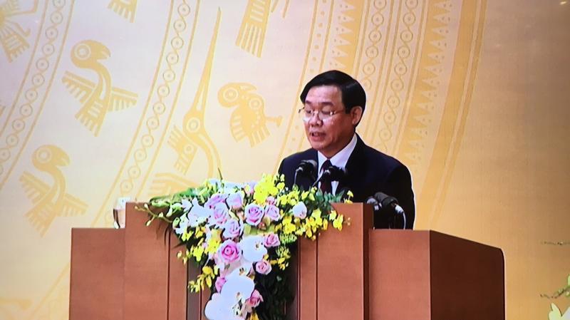 Phó thủ tướng Vương Đình Huệ trình bày dự thảo nghị quyết của Chính phủ về nhiệm vụ, giải pháp chủ yếu thực hiện kế hoạch 2019.