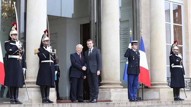 Tổng thống Pháp Emmanuel Macron tiếp đón và hội đàm với Tổng bí thư Nguyễn Phú Trọng - Ảnh: TTXVN.