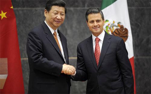 Chủ tịch Trung Quốc Tập Cận Bình (trái) và Tổng thống Mexico Enrique Pena Nieto trong chuyến thăm Mexico của ông Tập Cận Bình vào tháng 6/2013 - Ảnh: AFP/Getty.<br>