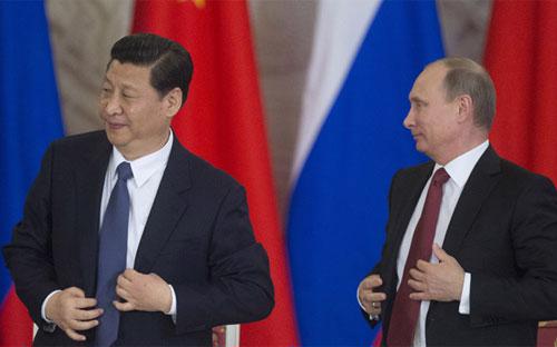 Chủ tịch Trung Quốc Tập Cận Bình (trái) và Tổng thống Nga Vladimir Putin trong chuyến thăm Trung Quốc của ông Putin mới đây - Ảnh: RT.<br>