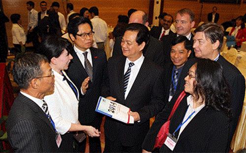Thủ tướng Nguyễn Tấn Dũng trong một lần gặp gỡ đại diện các doanh nghiệp. Môi trường kinh doanh tại Việt Nam đã có những chuyển động đáng kể trong năm 2014.<br>